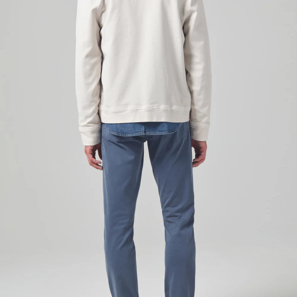 Back view of the muted blue London Tapered Slim Stretch Men's Pant from Citizens of Humanity