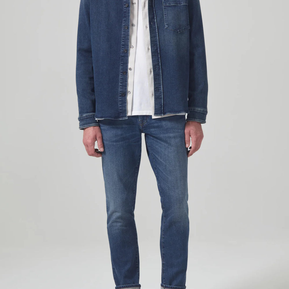 
                      
                        Front view of a man wearing the Parquet London Tapered Slim Archive Men's Jeans by Citizens Of Humanity
                      
                    