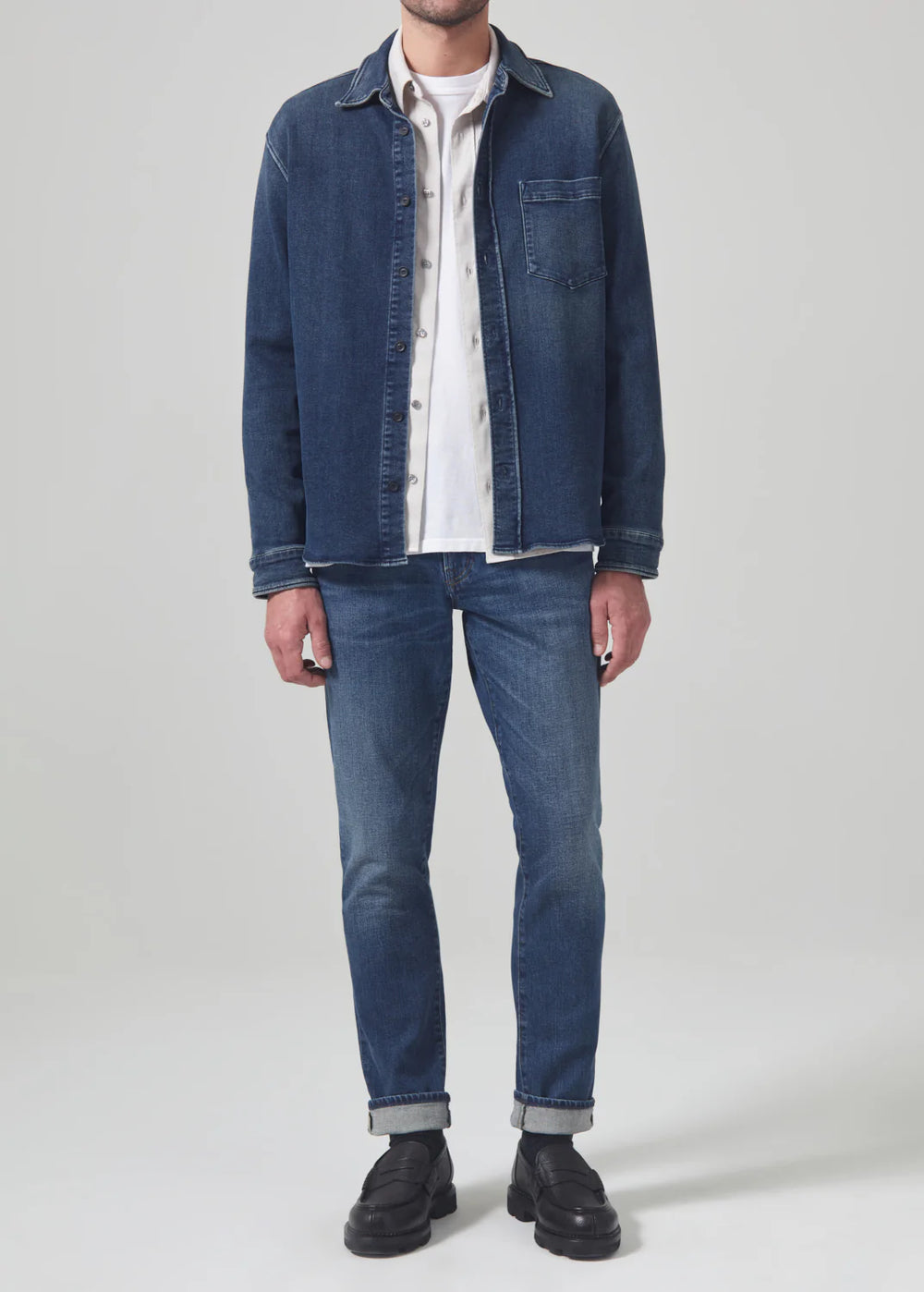 Front view of a man wearing the Parquet London Tapered Slim Archive Men's Jeans by Citizens Of Humanity