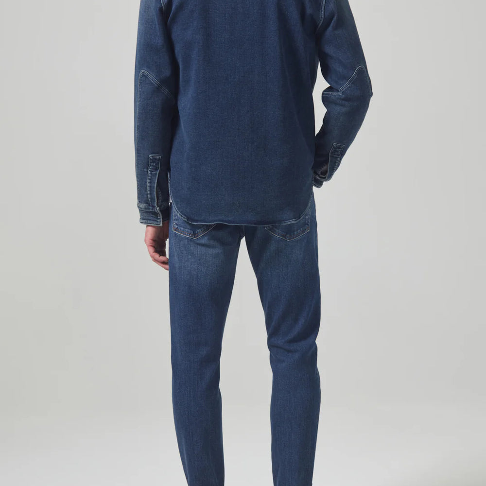 
                      
                        Back view of a man wearing the Parquet London Tapered Slim Archive Men's Jeans by Citizens Of Humanity
                      
                    