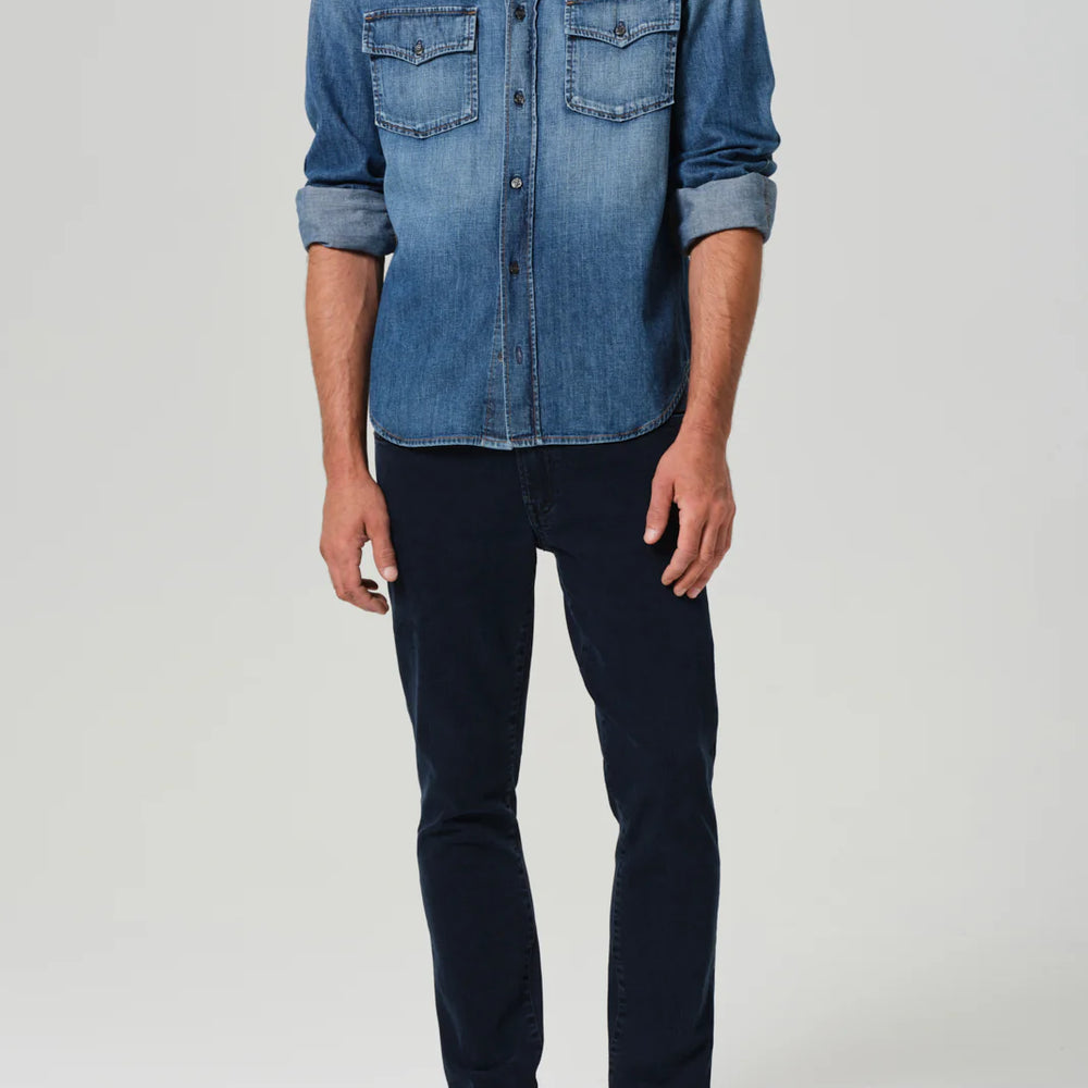 A man wearing the Gage Slim Straight Archive in the color Odessa, by Citizens Of Humanity