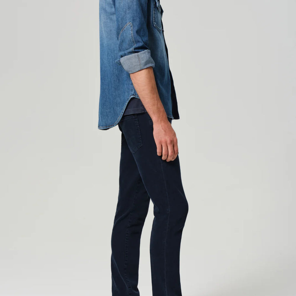 
                      
                        Side view of a man wearing the Gage Slim Straight Archive in the color Odessa, by Citizens Of Humanity
                      
                    