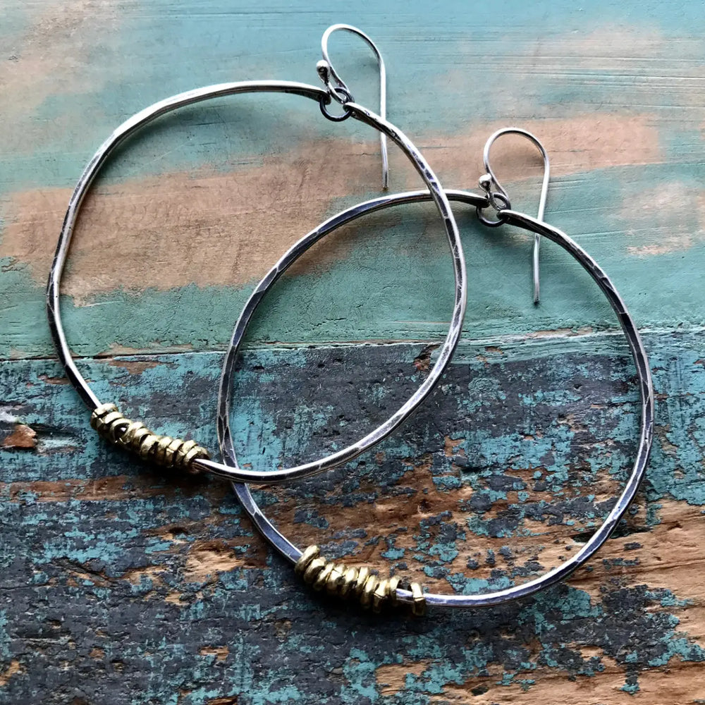 
                      
                        Jennifer Kahn Silver Hoop Earrings with Brass Heishi - Assorted Sizes
                      
                    