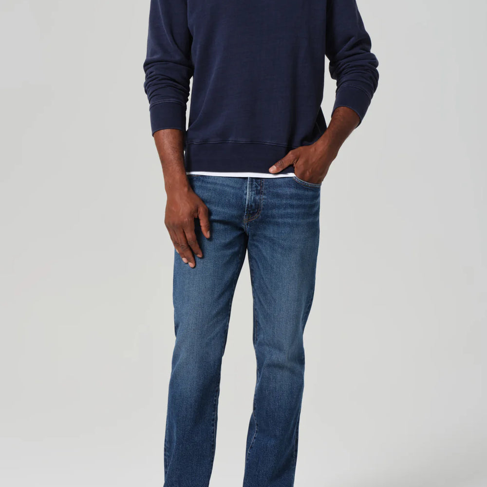 
                      
                        A man wearing the Elijah Straight Archive Men's Jeans in the color Falling Water
                      
                    