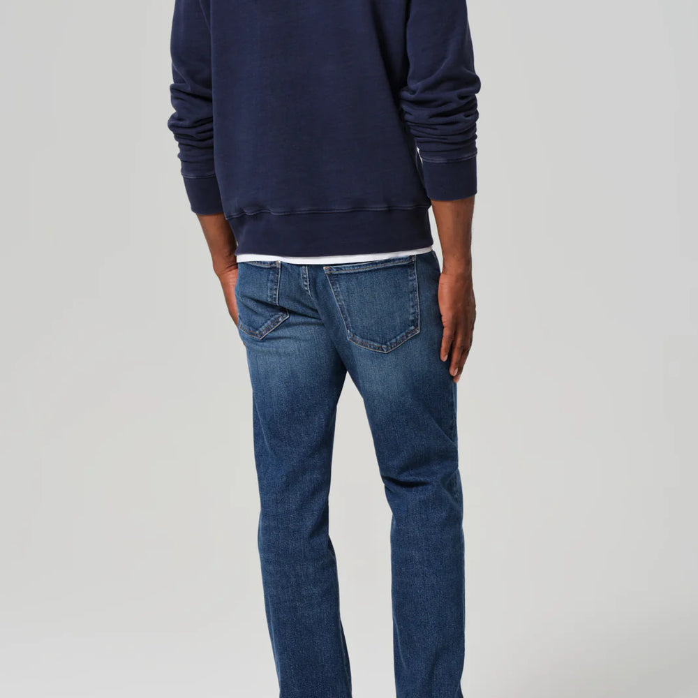 
                      
                        Back view of a man wearing the Elijah Straight Archive Men's Jeans in the color Falling Water
                      
                    
