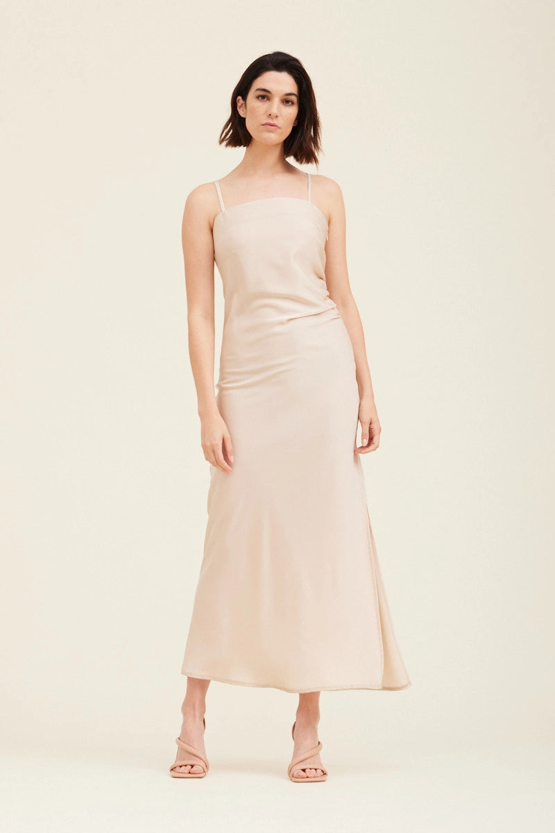 An ecru colored gathered side midi slip dress 