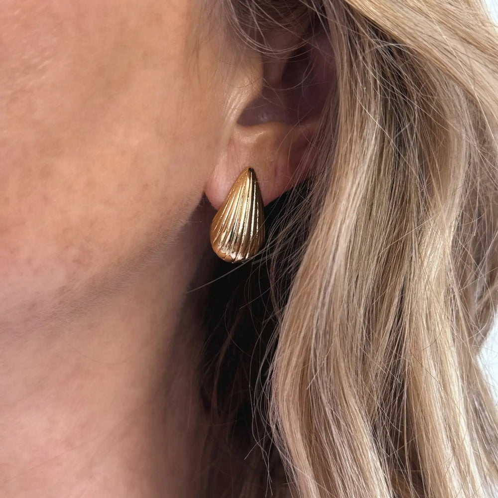 
                      
                        Woman wearing the Maris Stud Earrings by Jessica Matrasko Jewelry
                      
                    