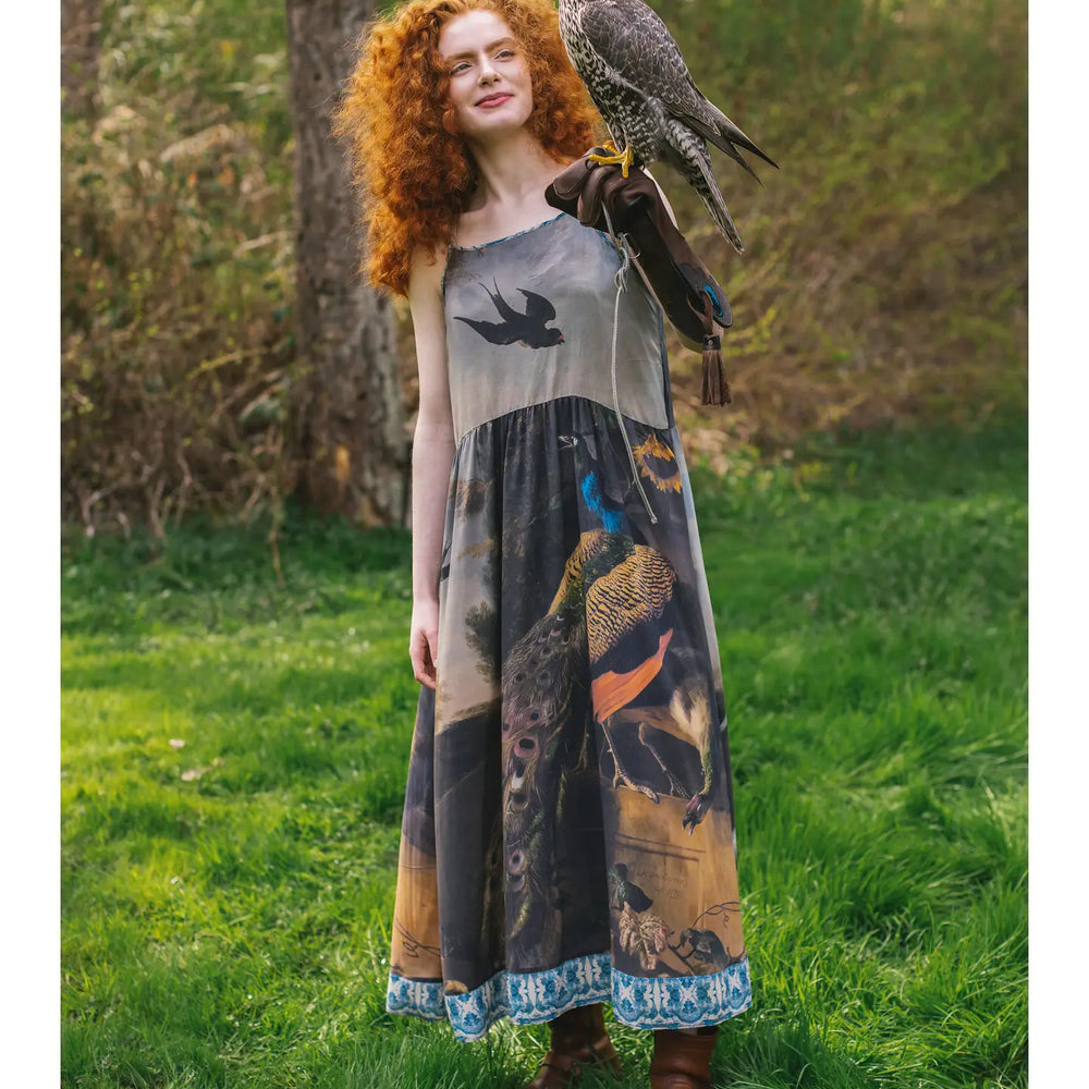 
                      
                        The Wild Beauty Peacock Print Slip Dress by Market of Stars worn with the bird design
                      
                    