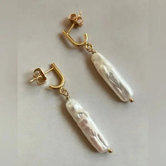 The Justiene Pearl Earrings by Tramps + Thieves, sold at Harbour Thread Burlington. 