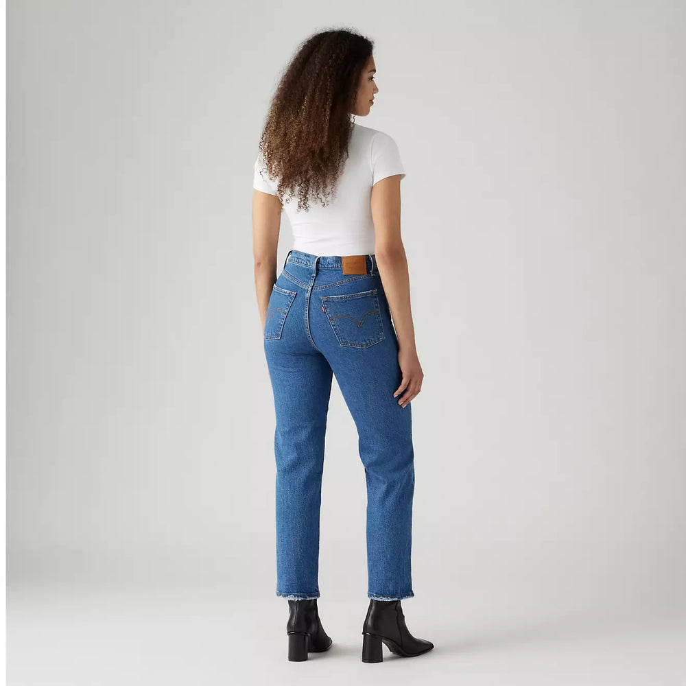 
                      
                        Back view of a woman wearing the azz Pop Medium Wash Ribcage Straight Ankle Women's Jeans by Levi’s
                      
                    