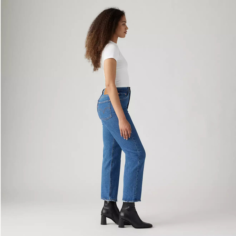 
                      
                        Side view of a woman wearing the azz Pop Medium Wash Ribcage Straight Ankle Women's Jeans by Levi’s
                      
                    