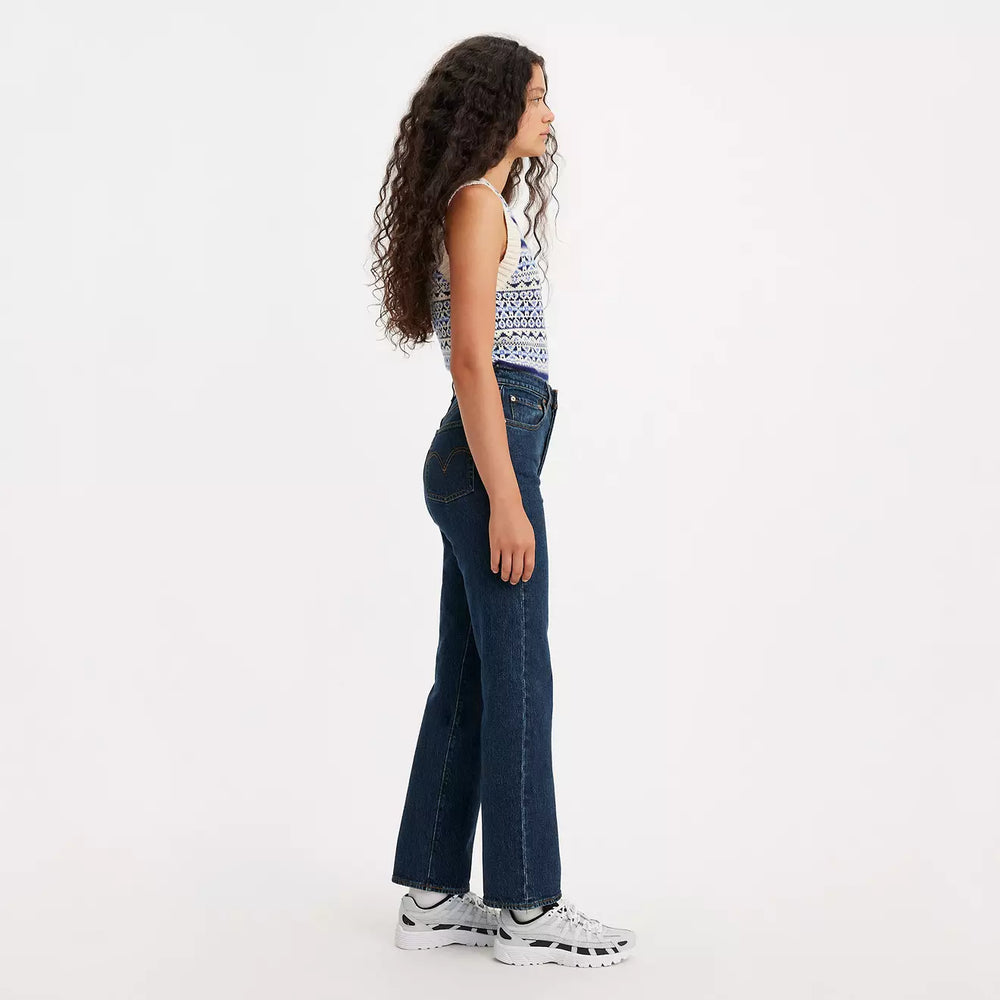 
                      
                        Side view of a woman wearing the Dark Stone Dark Wash Ribcage Straight Ankle Women's Jeans by Levi’s
                      
                    