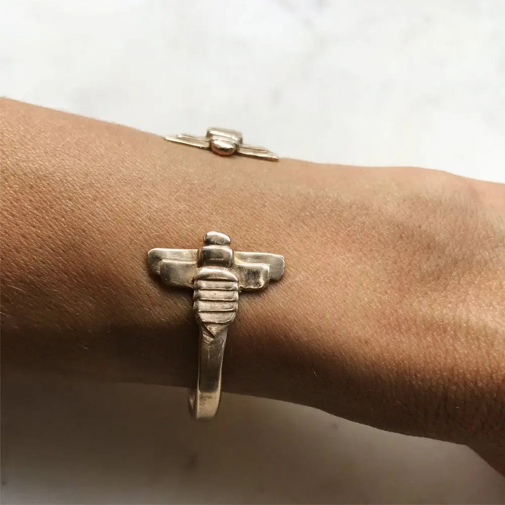 A persom wearing the Mimosa Handcrafted Bee Cuff