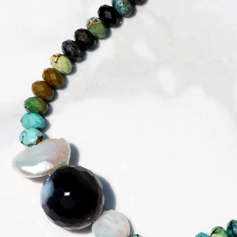 
                      
                        Close up view of the Olympia multi stone necklace by Native Gem
                      
                    