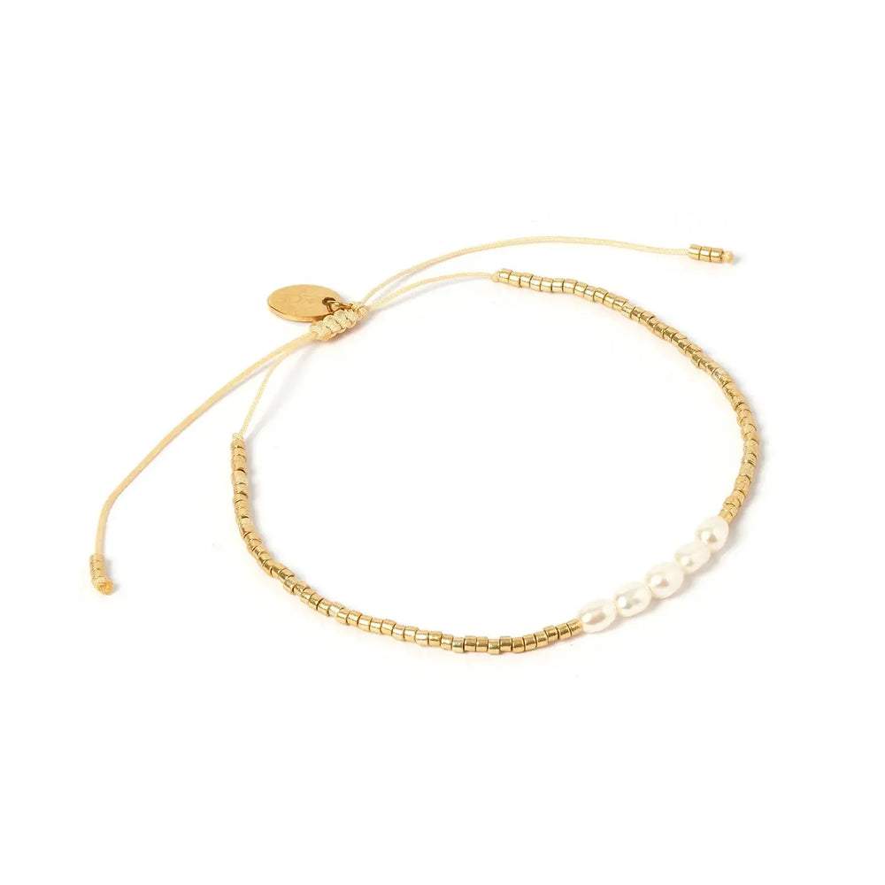 
                      
                        The Seline Gold and Pearl Bracelet by Arms of Eve
                      
                    