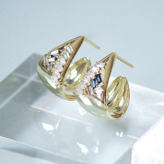 These 14K gold vermeil hoop earrings feature Black, Gray and Clear baguettes.