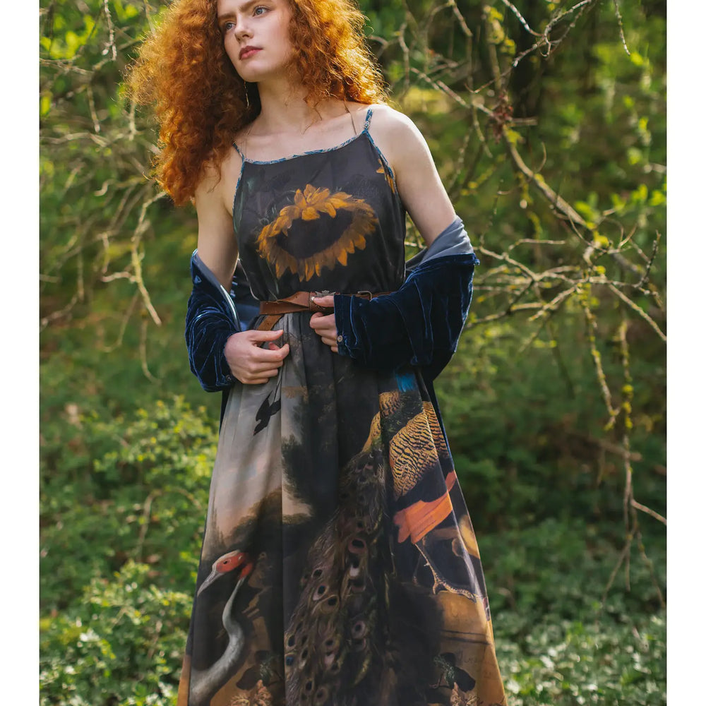 
                      
                        The Wild Beauty Peacock Print Slip Dress by Market of Stars worn with the floral print design
                      
                    