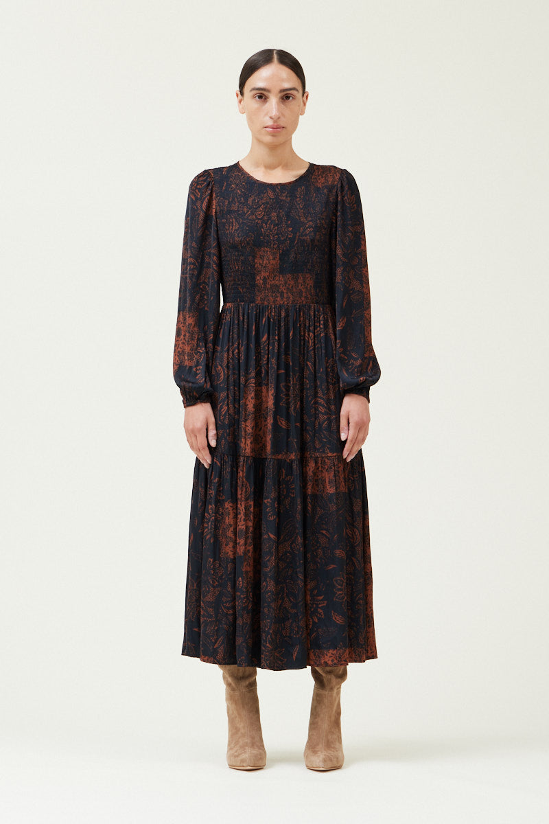 This autumnal printed midi dress from Grade and Gather features long balloon sleeves and a smocked bodice. Shop now at Harbour Thread. 


