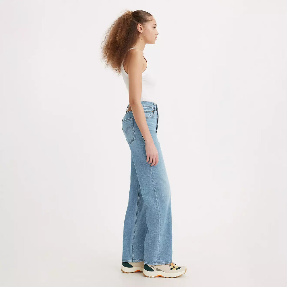 
                      
                        Side view of a woman wearing the Ribcage Full Length Women's Jeans by Levi's in the color Samba Tango Light
                      
                    