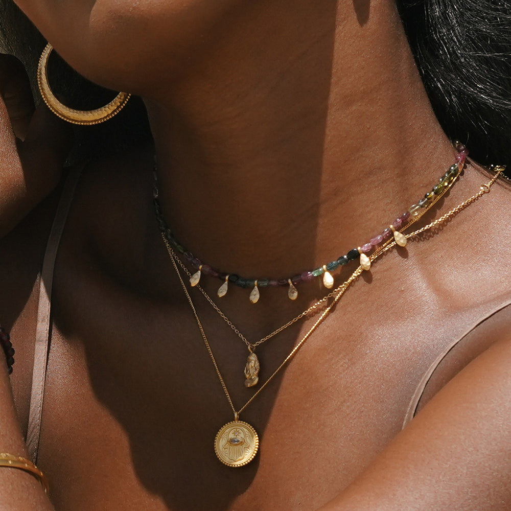 Add an extra dose of style to your look with the Beginning To Bloom Tourmaline Necklace by Satya Jewelry. Find it at Harbour Thread boutique!