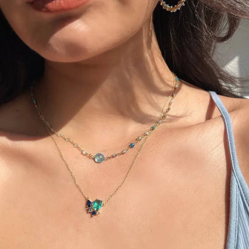 Woman wearing the Native Gem's Tropezinenne Necklace in Nile