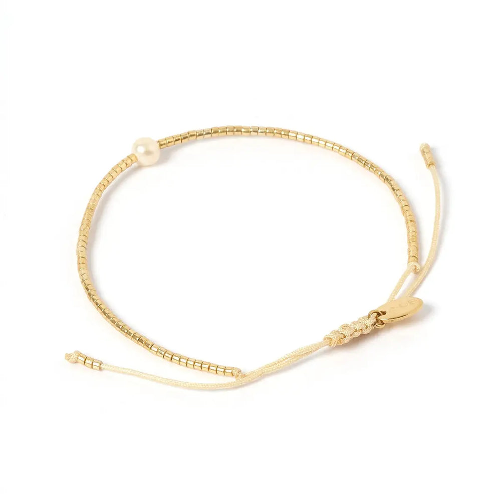 
                      
                        The River Gold and Pearl Bracelet by Arms of Eve
                      
                    