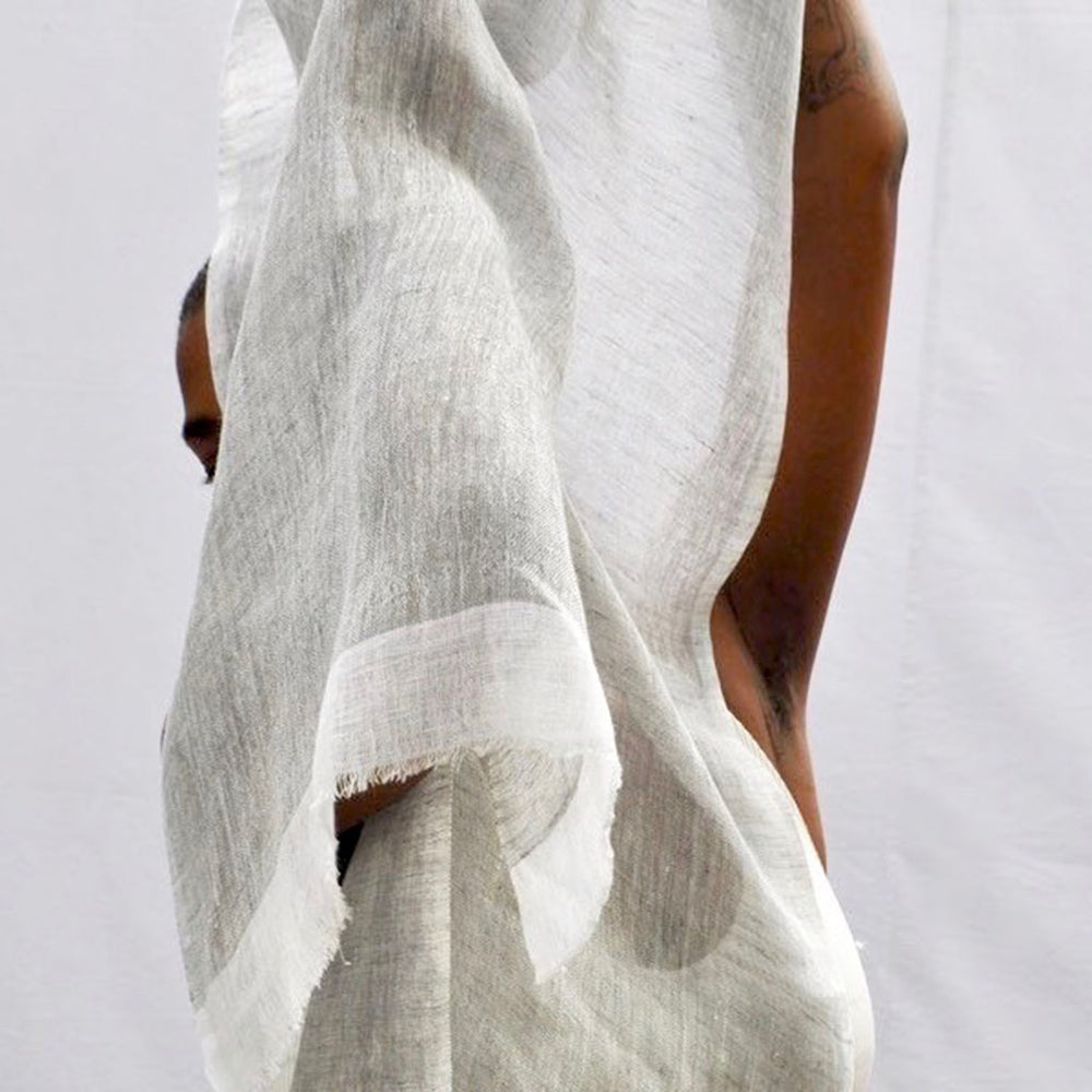 
                      
                        Person holding the Flax Gauze Linen Two-Tone Scarf by Slate + Salt
                      
                    