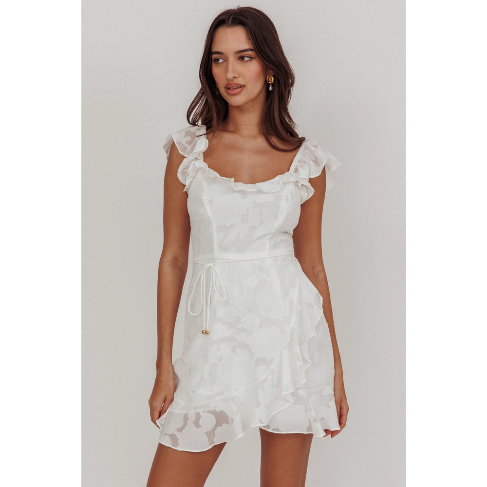Turn heads at your spring and summer events with this white ruffle floral mini dress, available now at Harbour Thread Burlington.