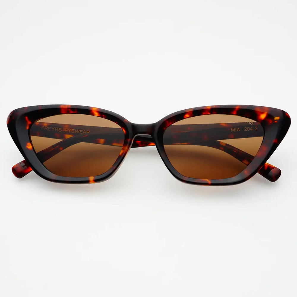 
                      
                        Brown tortoise shell cat eye sunglasses by FREYRS
                      
                    