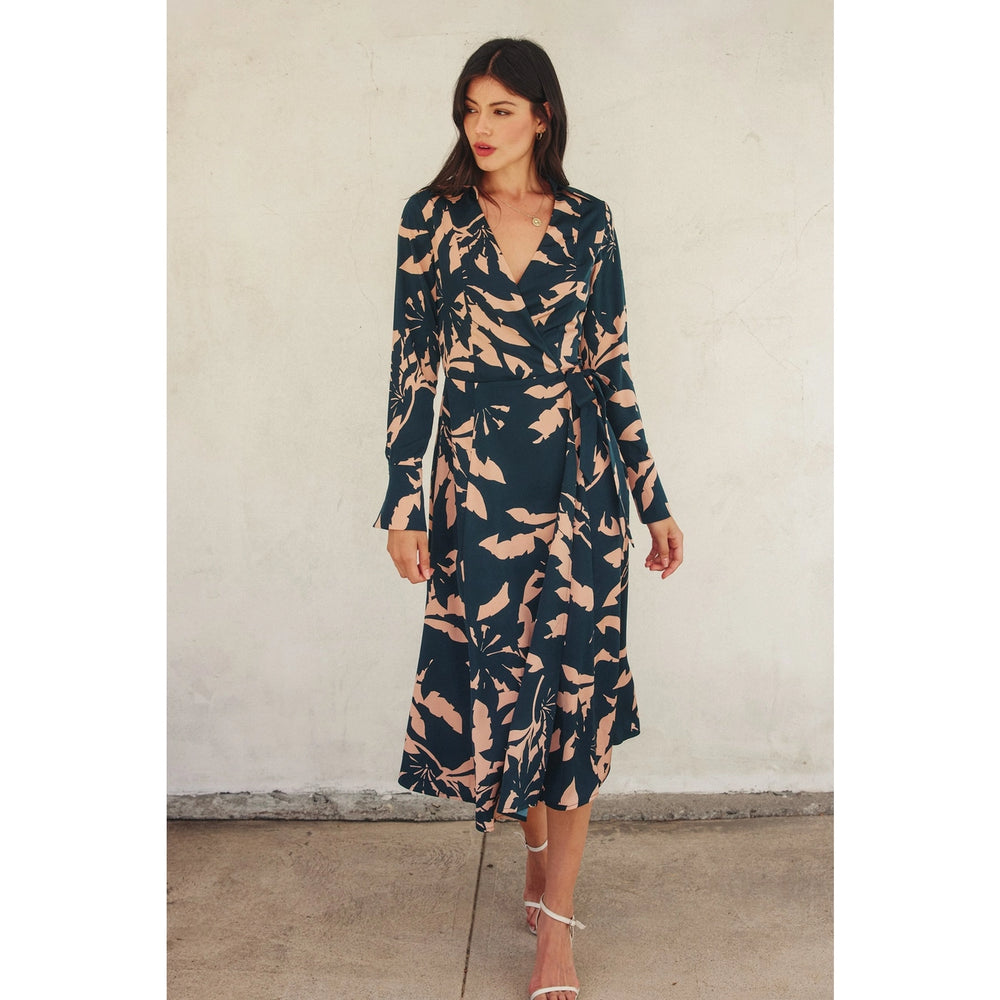 With a flattering wrap design, tropical leaf print and collared v-neckline, this midi dress at Harbour Thread will take you from work to weekend in style.