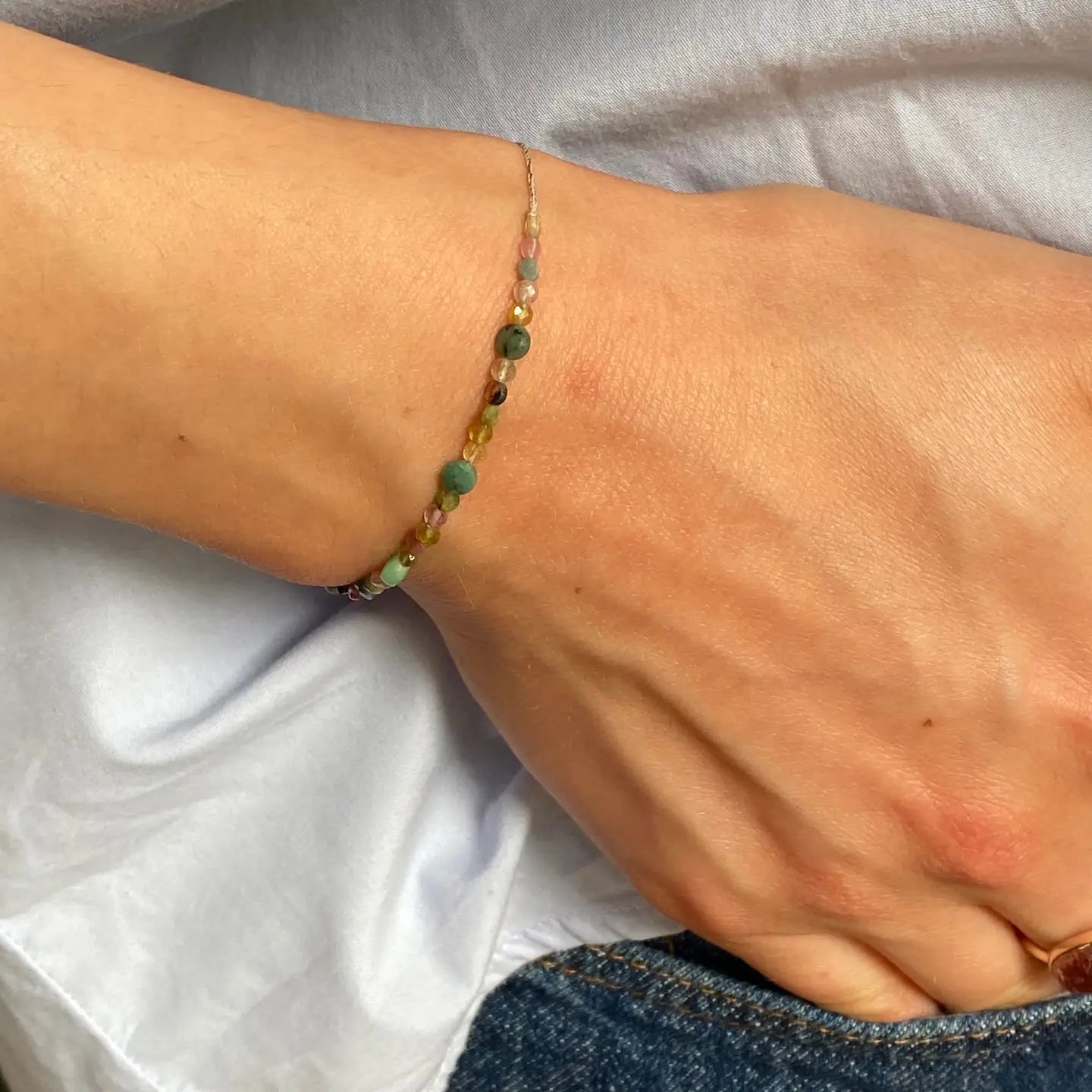 Close-up of a wrist with a beaded bracelet on 