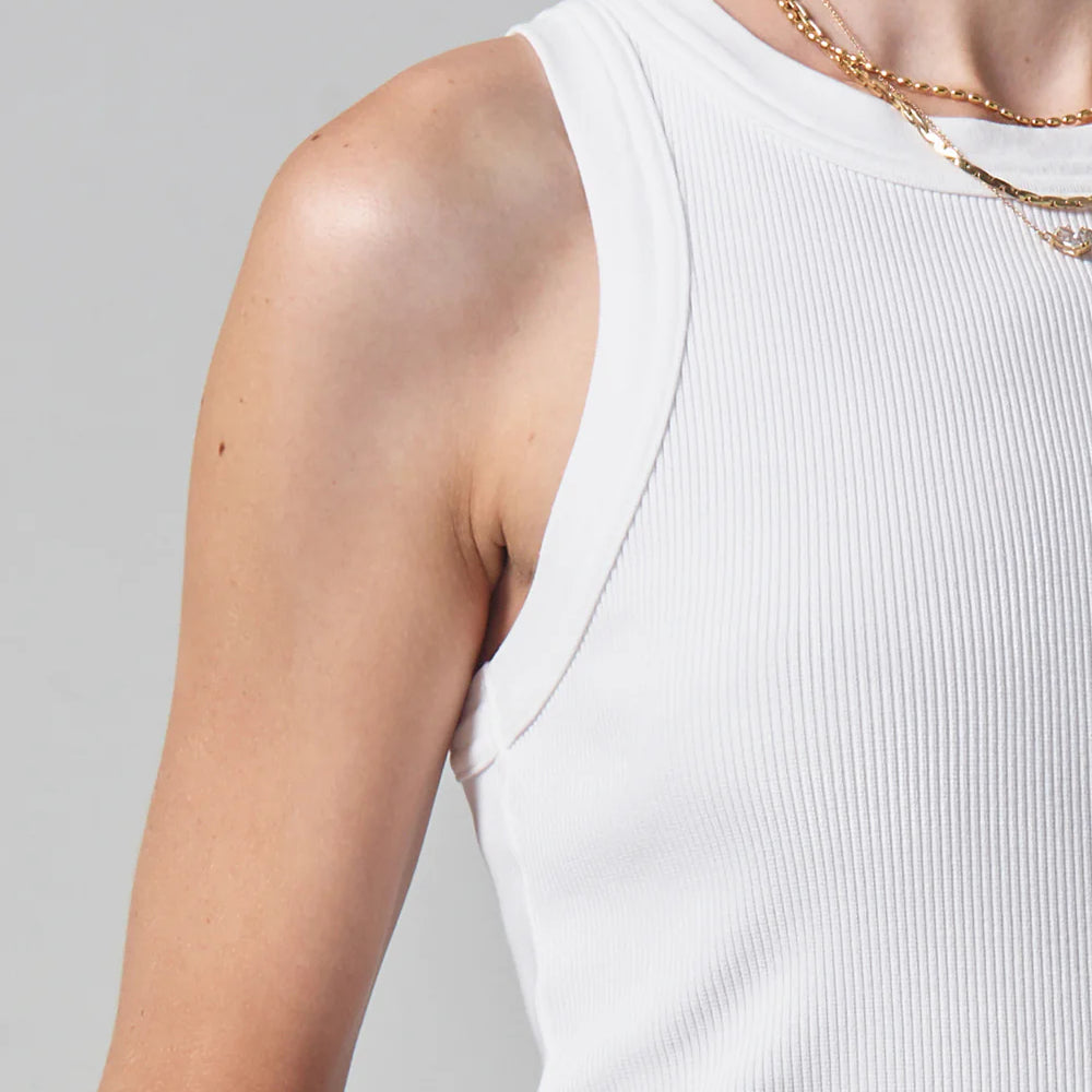 
                      
                        Closeup front detailed view of model wearing a white ribbed tank by Citizens of Humanity
                      
                    