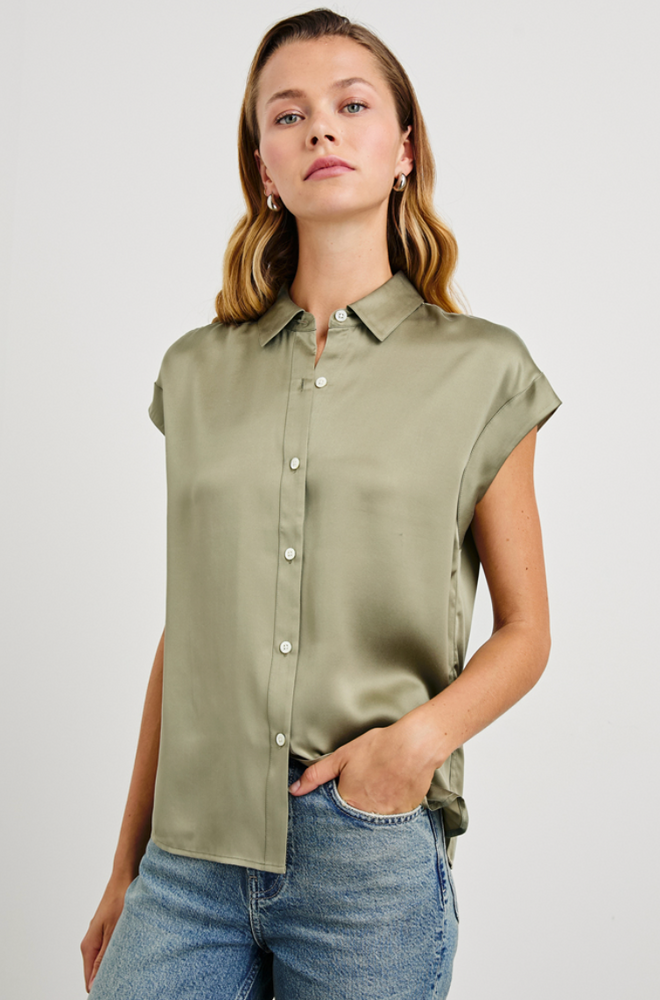 A woman wearing the Palmer Dolman Sleeve Silk Shirt in the color Mermaid by the brand Rails