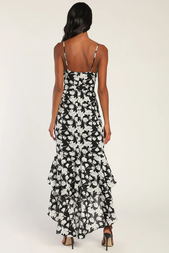 Back view of a woman wearing a White and Black Floral Print High-Low Maxi Dress by LuLu's