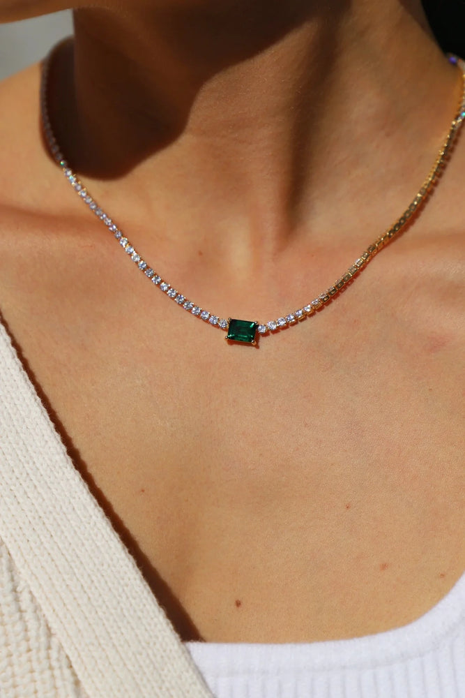 
                      
                        Woman wearing the Heirloom Emerald Necklace by Katie Waltman Jewelry
                      
                    