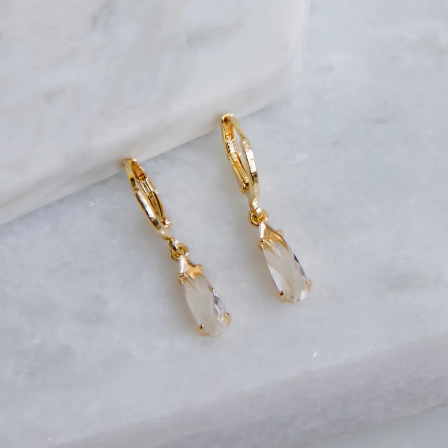 The Mesa Blue Clear Crystal Teardrop Huggie Earrings