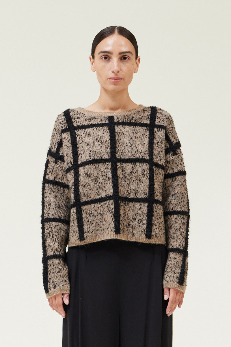 Front view of a woman wearing a Cropped Grid Sweater by Grade & Gather