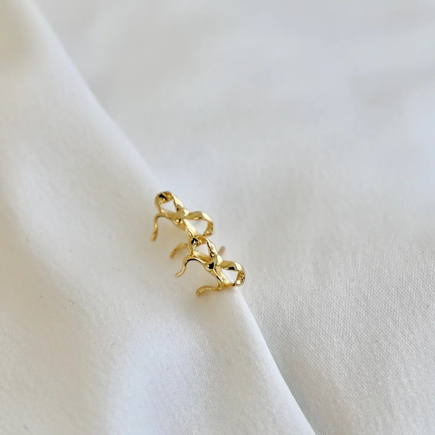 Find the Golden Bow Studs by Katie Waltman Jewelry at Harbour Thread.