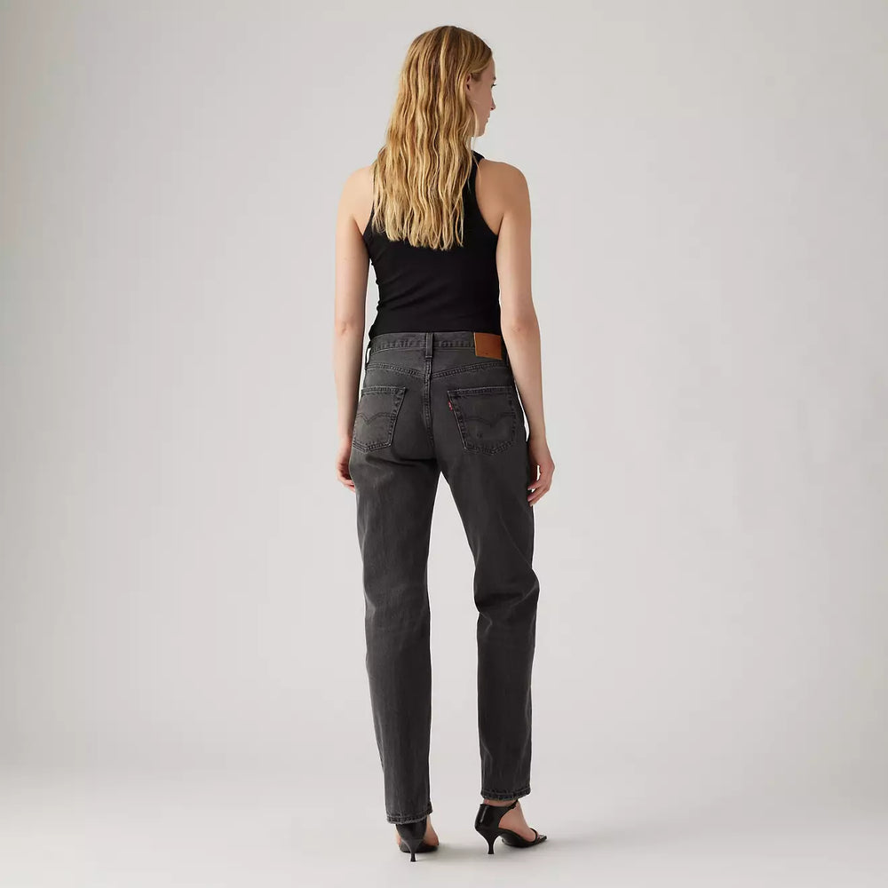 Back view of a woman wearing the Stitch School Black 501 90's Women's Jeans by Levi's