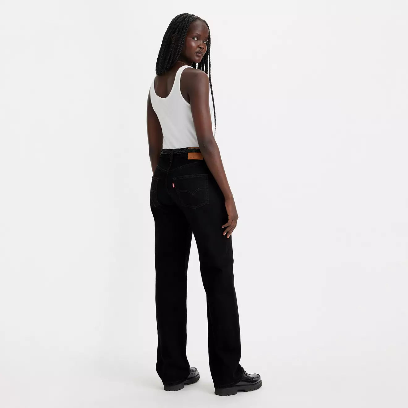 A woman wearing a pair of black Levi's 501 90's Women's Jeans