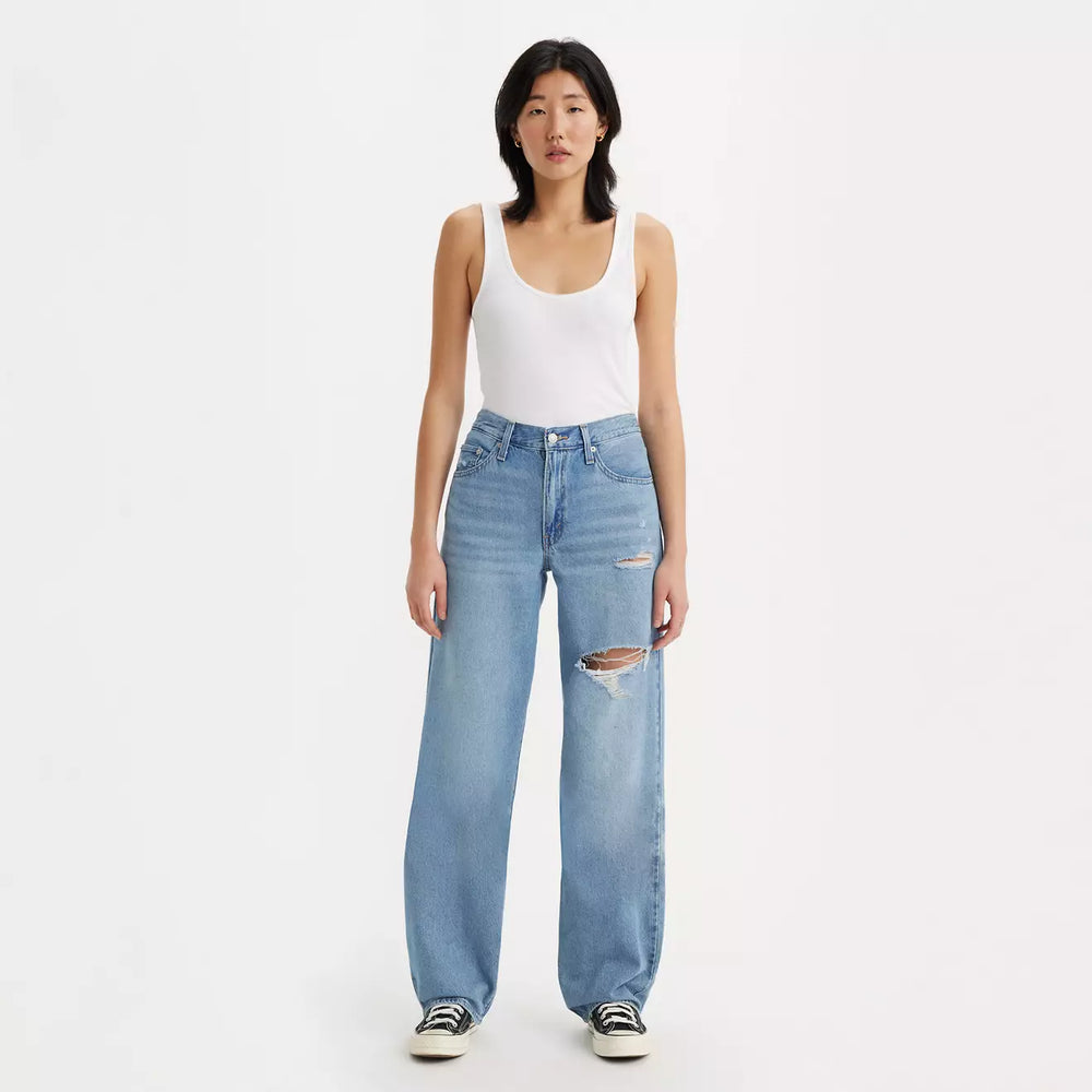 
                      
                        Front view of a woman wearing the In The Middle Medium Wash Distressed Baggy Dad Women's Jeans by Levi's
                      
                    