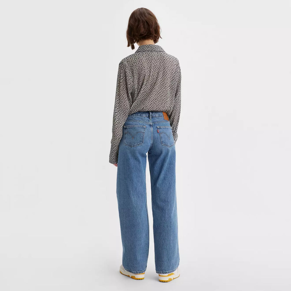 Back view of a woman wearing the Real Recognize Real Medium Wash Low Loose Wide Leg Women's Jeans by Levi’s