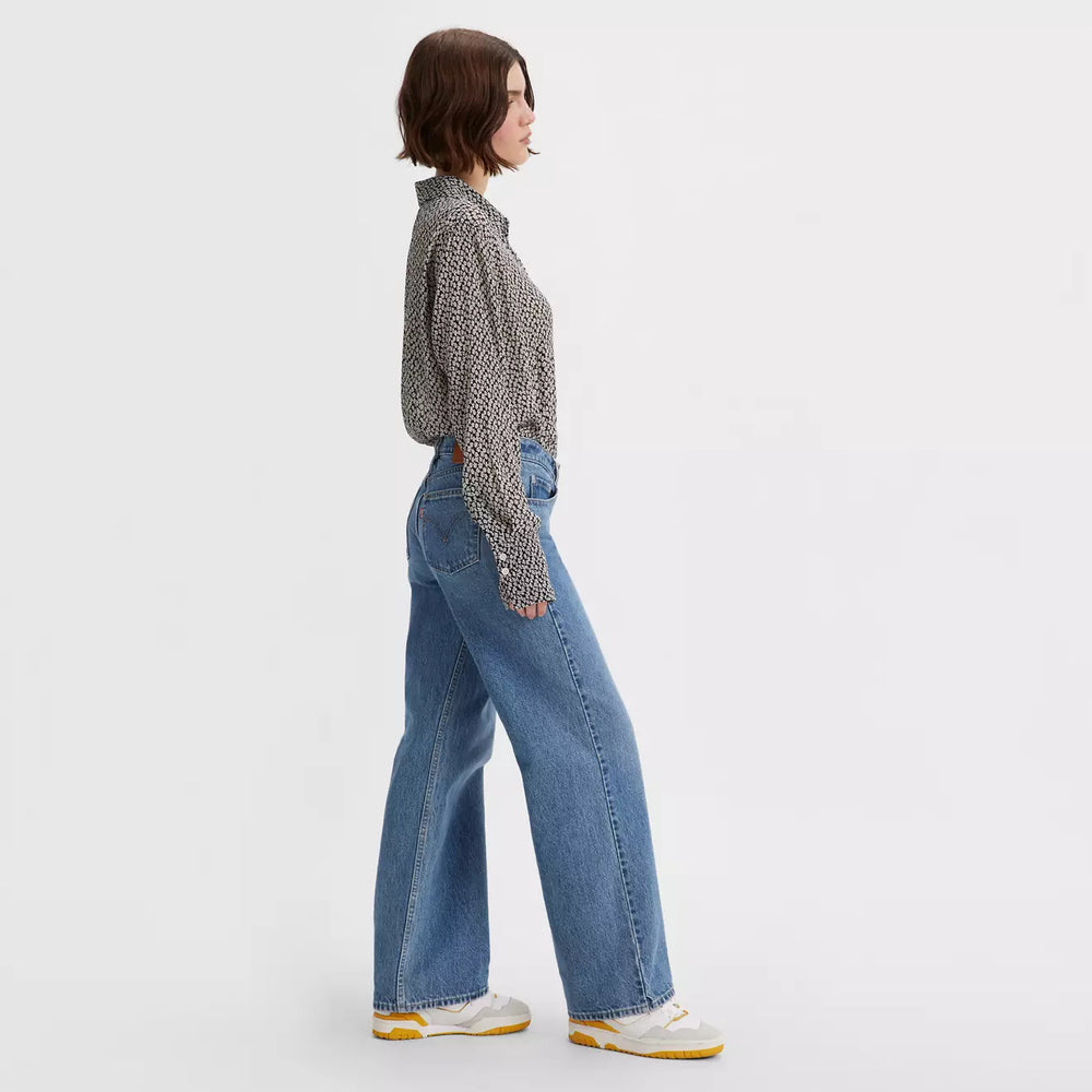 
                      
                        Side view of a woman wearing the Real Recognize Real Medium Wash Low Loose Wide Leg Women's Jeans by Levi’s
                      
                    