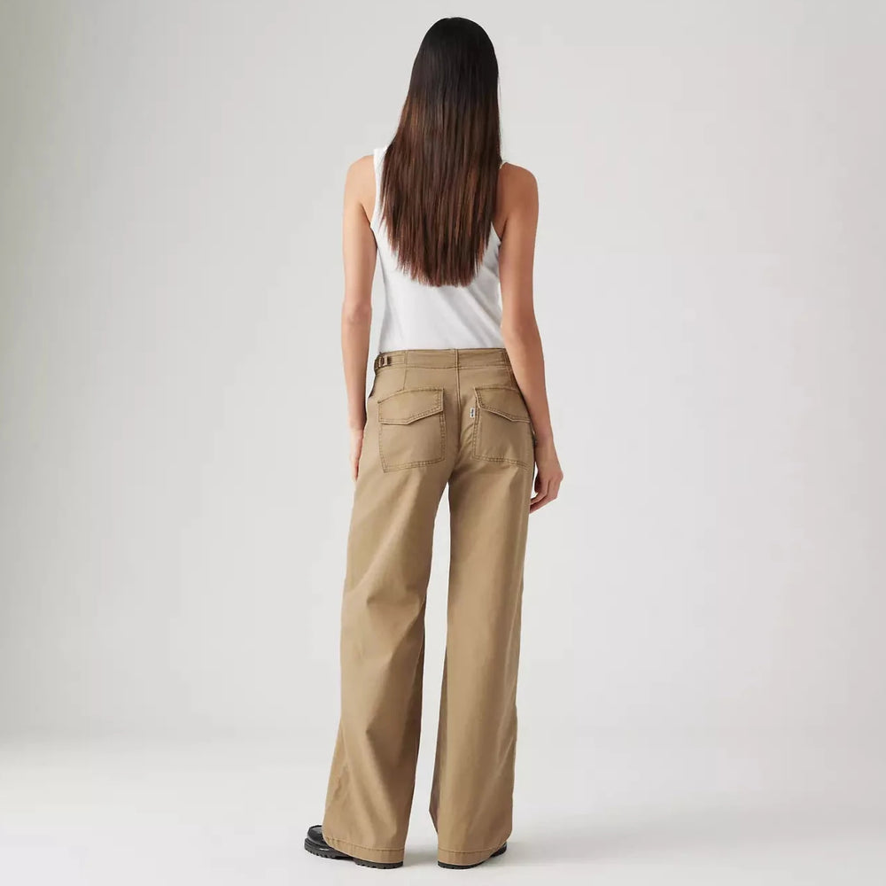 Back view of a woman wearing the Tan Surplus Straight Women's Pants by Levi’s