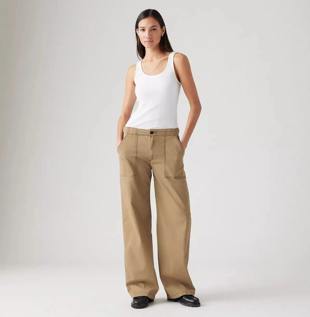 Front view of a woman wearing the Tan Surplus Straight Women's Pants by Levi’s