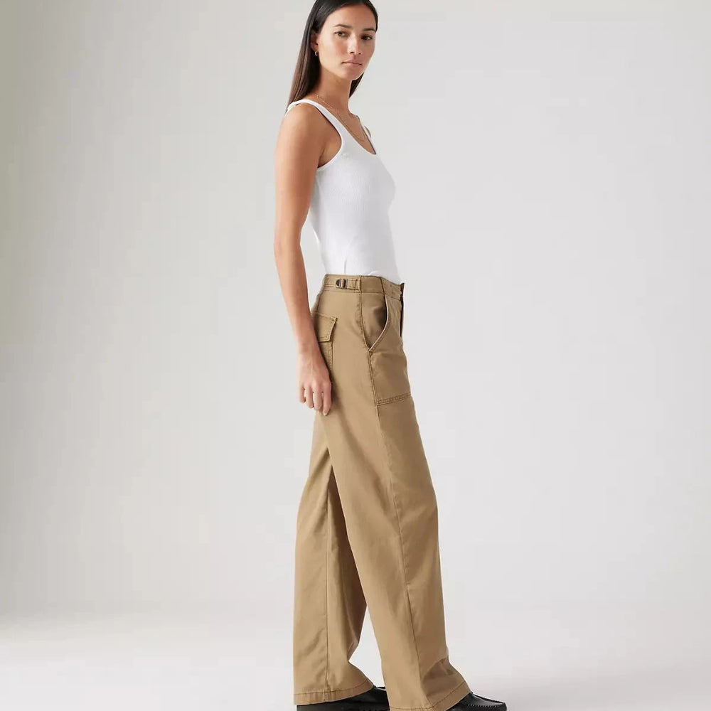 
                      
                        Side view of a woman wearing the Tan Surplus Straight Women's Pants by Levi’s
                      
                    