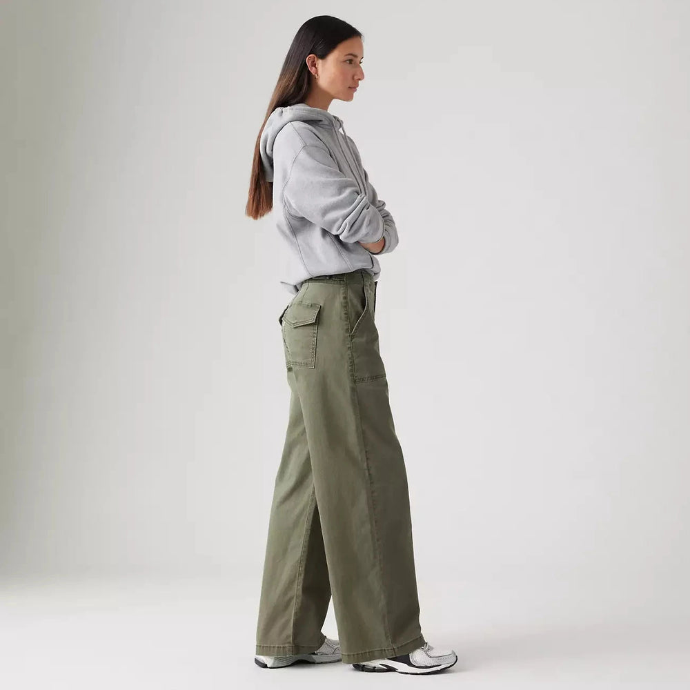 
                      
                        Side view of a woman wearing the Olive Green Surplus Straight Women's Pants by Levi’s
                      
                    