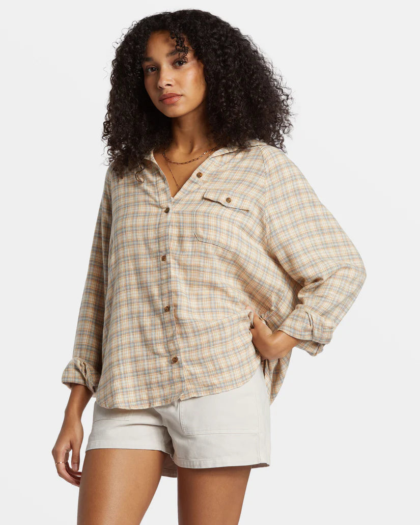 A woman wearing the Western Sky Plaid Best Time Long Sleeve Shirt by Billabong