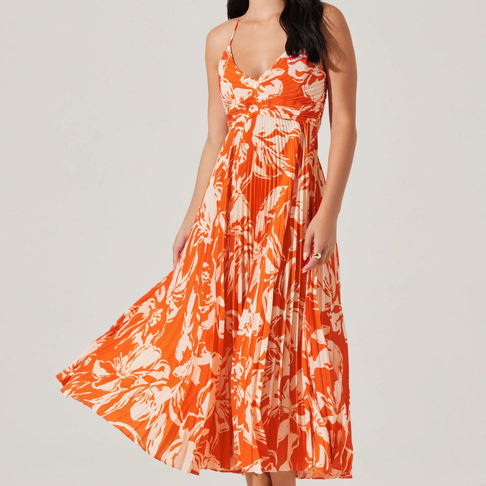 Enjoy effortless summer style at any event in the Blyth Floral Plisse Midi Dress by ASTR. Find yours at Harbour Thread boutique in St. Pete, FL!