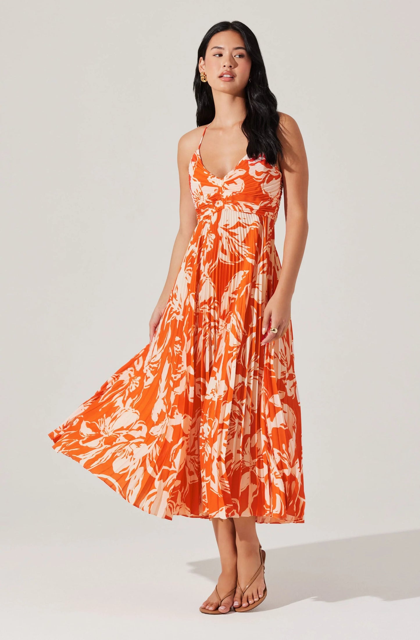 Enjoy effortless summer style at any event in the Blyth Floral Plisse Midi Dress by ASTR. Find yours at Harbour Thread boutique in St. Pete, FL!